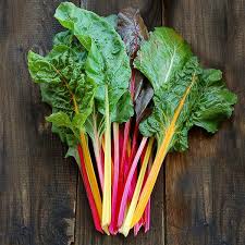 Bunch of swiss chard on a wooden surface